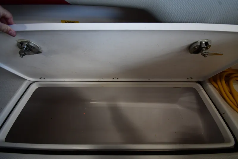 Slide: The Image of Storage compartment of a 2009 Donzi 38 ZFX Open boat, lid open. - 44