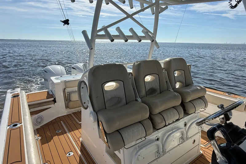 Slide: The Image of 2017 Sea Fox 328 Commander boat interior with plush seating and ocean view. - 14