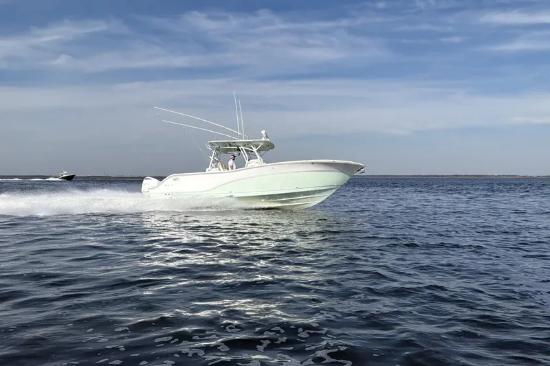 Slide: The Image of 2017 Sea Fox 328 Commander cruising on open water under a clear sky. - 5