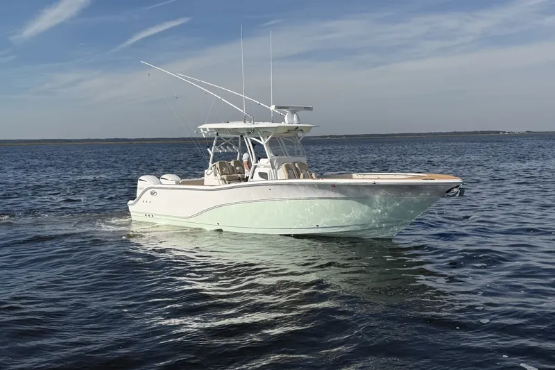 Slide: The Image of 2017 Sea Fox 328 Commander boat cruising on open water under a clear sky. - 4