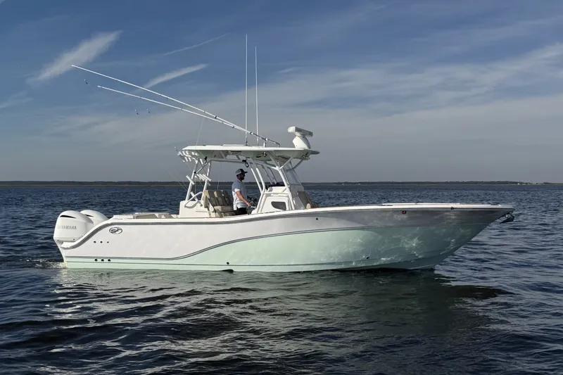 Slide: The Image of 2017 Sea Fox 328 Commander boat cruising on open water under clear skies. - 2