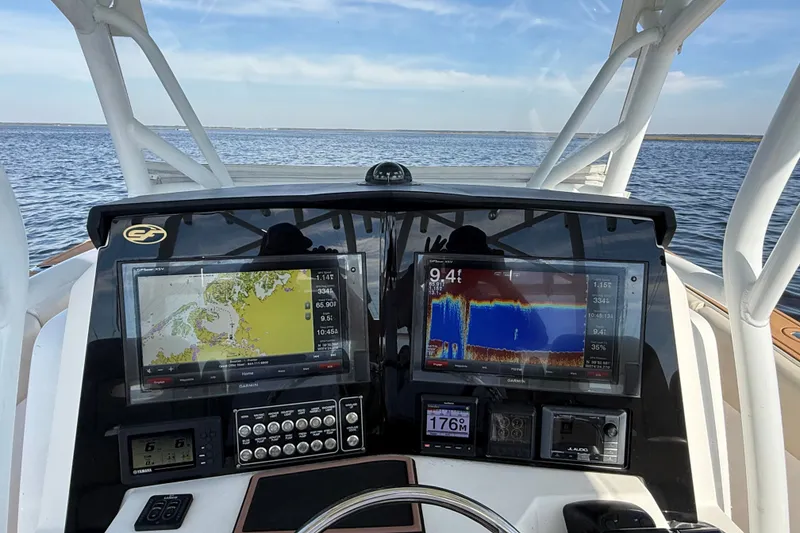 Slide: The Image of Dashboard of a 2017 Sea Fox 328 Commander boat with navigation screens. - 16