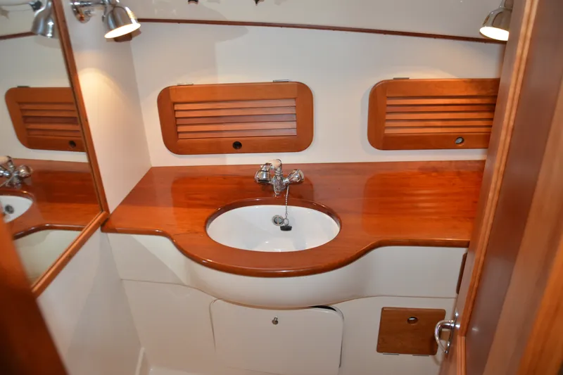 Slide: The Image of Luxurious wooden bathroom interior of 2002 Hinckley Picnic Boat 36 EP. - 19