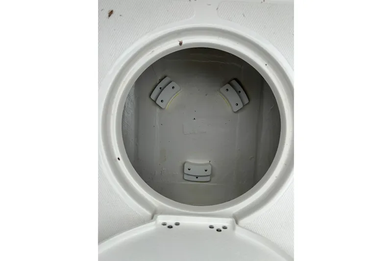 Slide: The Image of Circular compartment inside 2027 Ranger 2660 Bay boat, featuring secure brackets. - 24