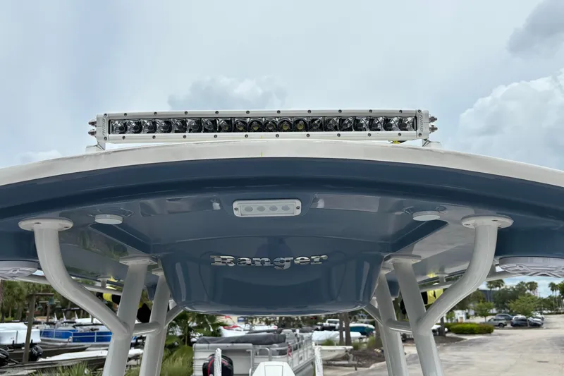 Slide: The Image of Ranger 2660 Bay 2027 boat with LED light bar on top, cloudy sky background. - 22