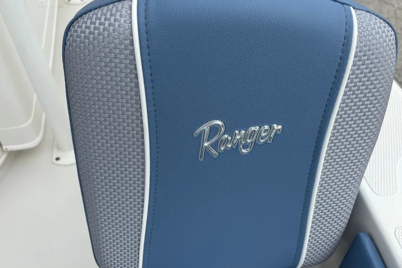 Slide: The Image of Blue and gray seat with "Ranger" logo on 2027 Ranger 2660 Bay boat. - 26
