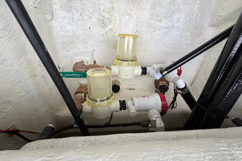 Slide: The Image of Boat plumbing system in 2027 Ranger 2660 Bay, featuring filters and pipes. - 35