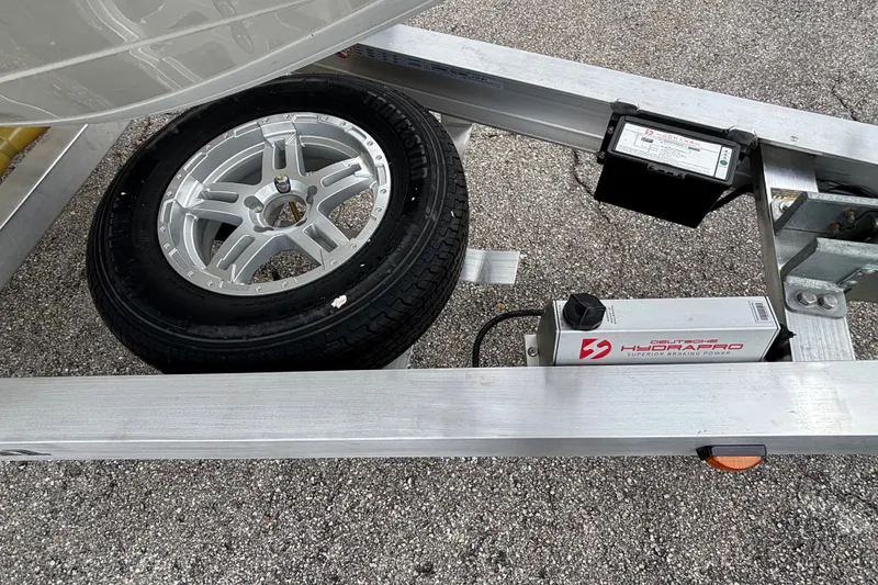Slide: The Image of Trailer with spare tire and hydraulic brake system for 2027 Ranger 2660 Bay boat. - 37