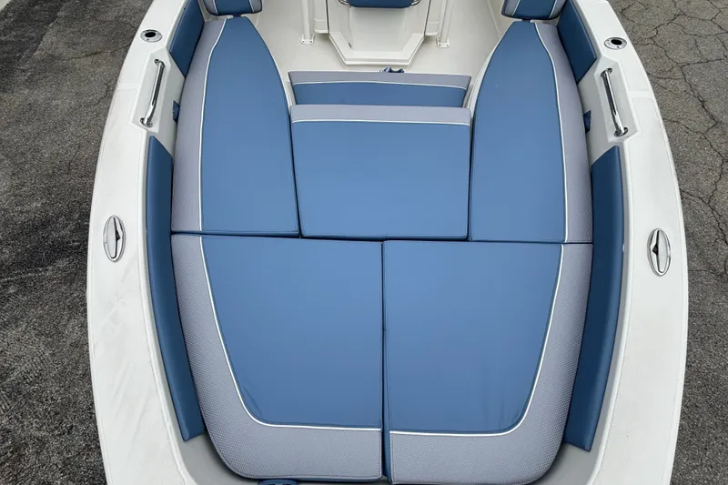 Slide: The Image of 2027 Ranger 2660 Bay boat with blue cushioned seating, top view. - 21