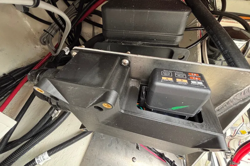 Slide: The Image of Electrical components inside a 2027 Ranger 2660 Bay boat, featuring wiring and relay systems. - 36