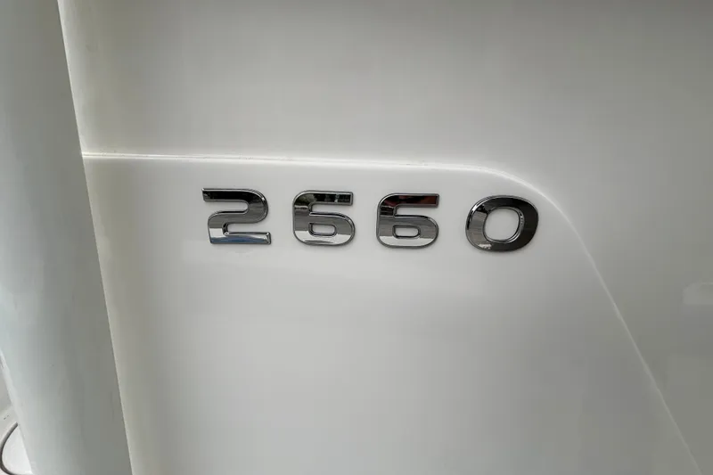 Slide: The Image of Ranger 2660 Bay 2027 model emblem on sleek white surface. - 20
