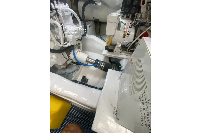 Slide: The Image of Engine room of 2005 Ocean Yachts 73 Super Sport, showcasing mechanical components and systems. - 44