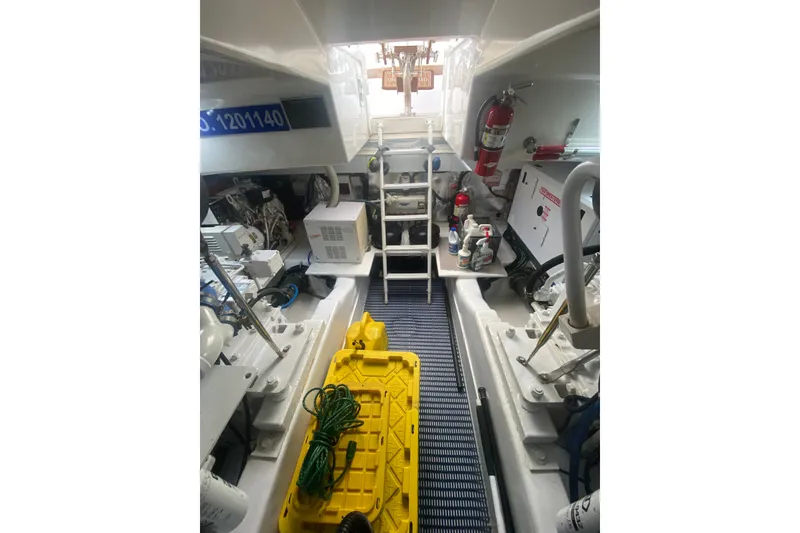 Slide: The Image of Engine room of 2005 Ocean Yachts 73 Super Sport with equipment and safety gear. - 35