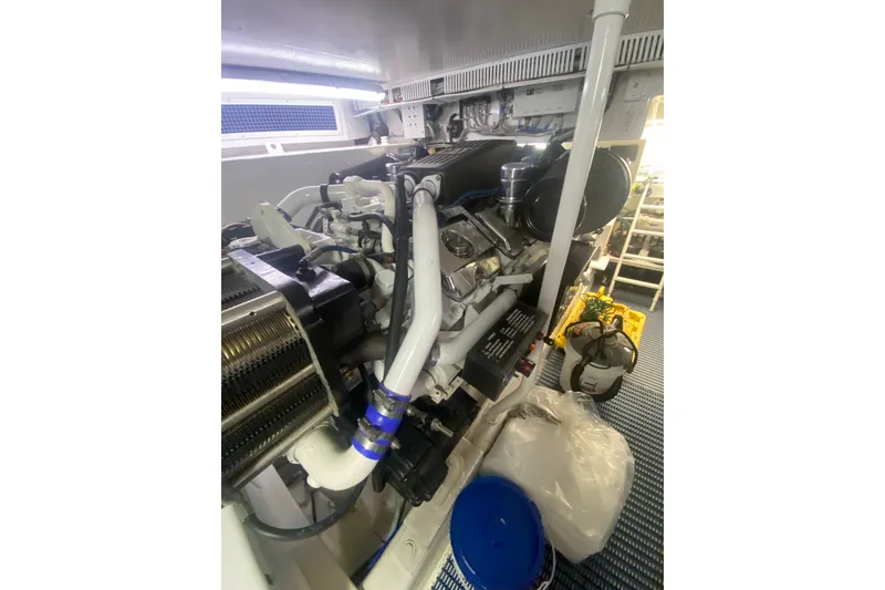 Slide: The Image of Engine room of 2005 Ocean Yachts 73 Super Sport, showcasing mechanical components and equipment. - 36