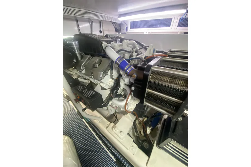 Slide: The Image of Engine room of a 2005 Ocean Yachts 73 Super Sport, showcasing detailed machinery. - 37
