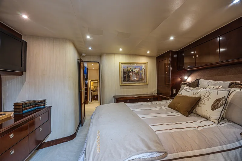 Slide: The Image of Luxurious bedroom interior of 2005 Ocean Yachts 73 Super Sport with elegant decor and lighting. - 14