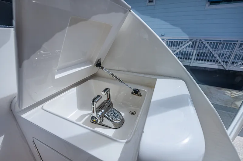 Slide: The Image of Built-in sink with faucet on 2005 Ocean Yachts 73 Super Sport boat deck. - 33