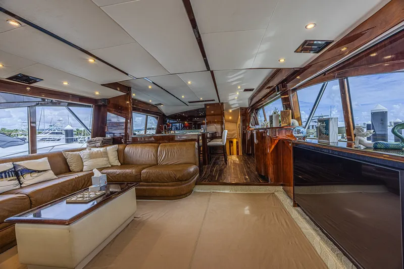 Slide: The Image of Luxurious interior of a 2005 Ocean Yachts 73 Super Sport, featuring elegant seating and panoramic windows. - 32