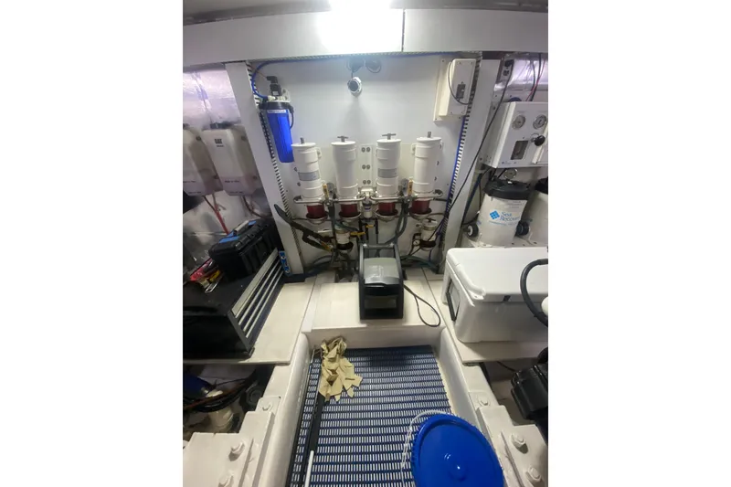 Slide: The Image of Engine room of 2005 Ocean Yachts 73 Super Sport with filtration systems and equipment. - 40