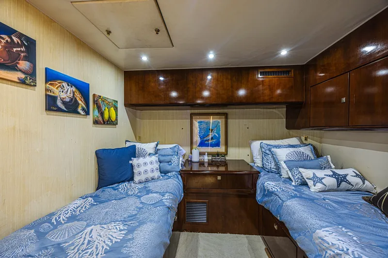 Slide: The Image of Luxurious cabin interior of 2005 Ocean Yachts 73 Super Sport with nautical-themed decor. - 18