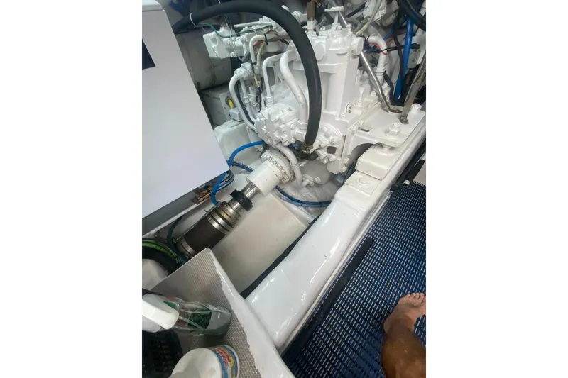 Slide: The Image of Engine room of 2005 Ocean Yachts 73 Super Sport, showcasing mechanical components and wiring. - 45