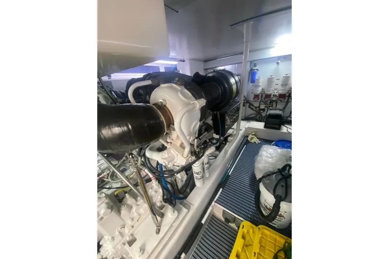 Slide: The Image of Engine room of 2005 Ocean Yachts 73 Super Sport, showcasing mechanical components and equipment. - 41