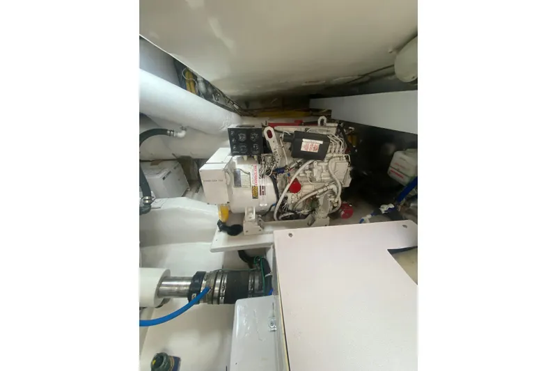 Slide: The Image of Engine room of 2005 Ocean Yachts 73 Super Sport, showcasing mechanical components. - 43