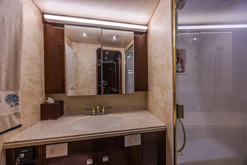 Slide: The Image of Luxurious bathroom in 2005 Ocean Yachts 73 Super Sport with elegant fixtures and spacious shower. - 19