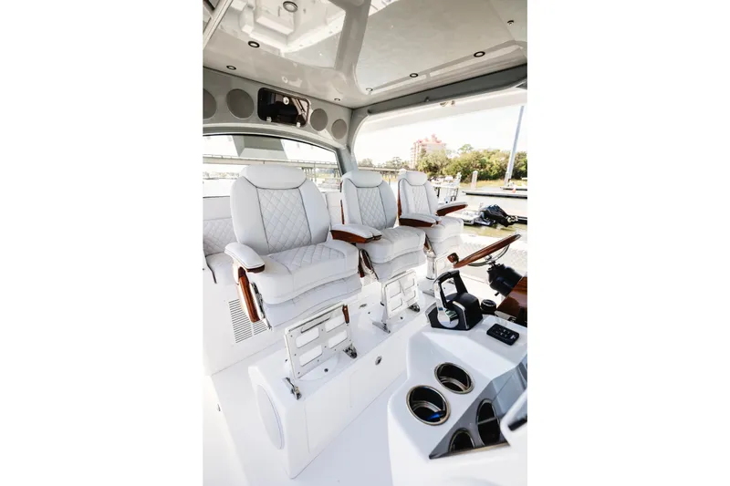 Slide: The Image of Luxurious interior of 2026 HCB 48 Campeón boat with plush seating and modern controls. - 15