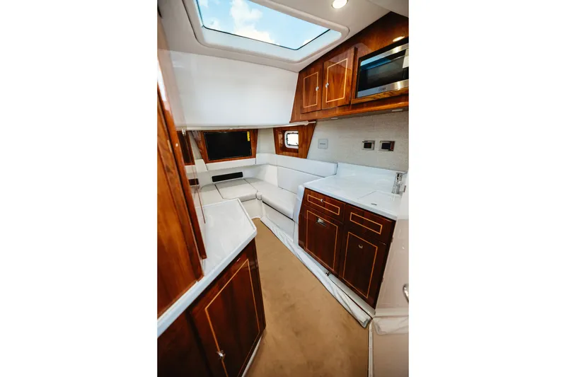 Slide: The Image of Luxurious interior of 2026 HCB 48 Campeón yacht with elegant wood cabinetry and seating. - 22