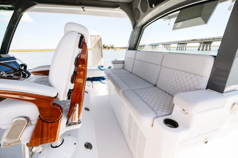 Slide: The Image of Luxurious interior of 2026 HCB 48 Campeón boat with plush seating and elegant design. - 17