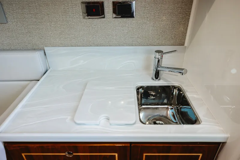 Slide: The Image of Modern kitchenette sink in 2026 HCB 48 Campeón yacht, featuring sleek design and chrome faucet. - 27