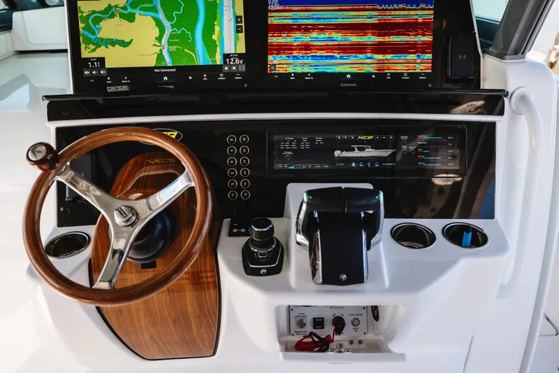 Slide: The Image of Helm of 2026 HCB 48 Campeón with advanced navigation displays and controls. - 50
