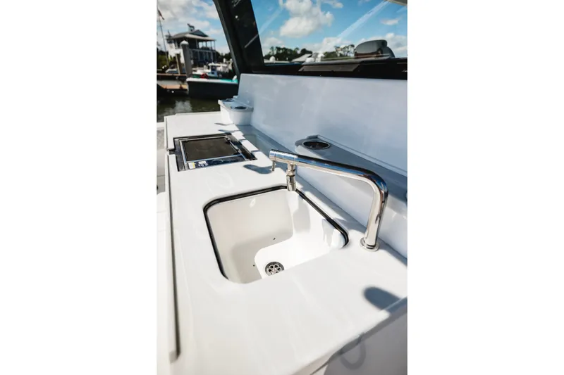 Slide: The Image of Modern sink and faucet on 2026 HCB 48 Campeón boat, with sleek design and marina view. - 55