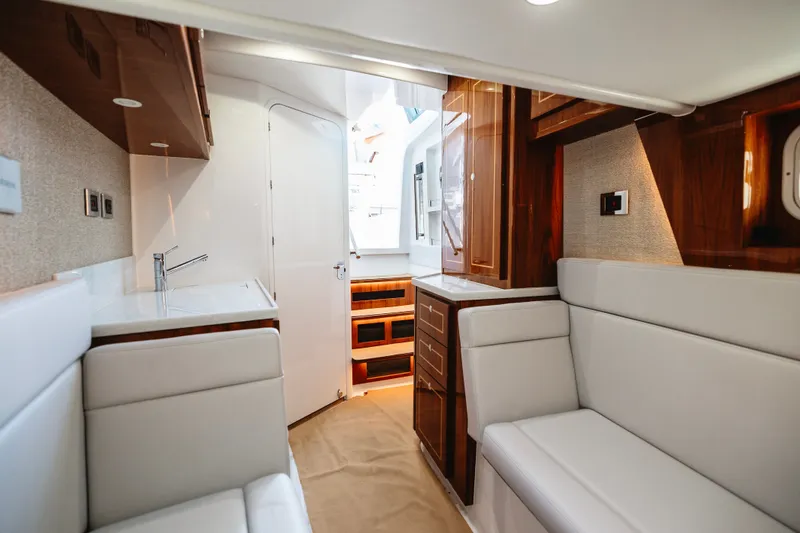 Slide: The Image of Luxurious interior of 2026 HCB 48 Campeón yacht with modern furnishings and wood accents. - 39