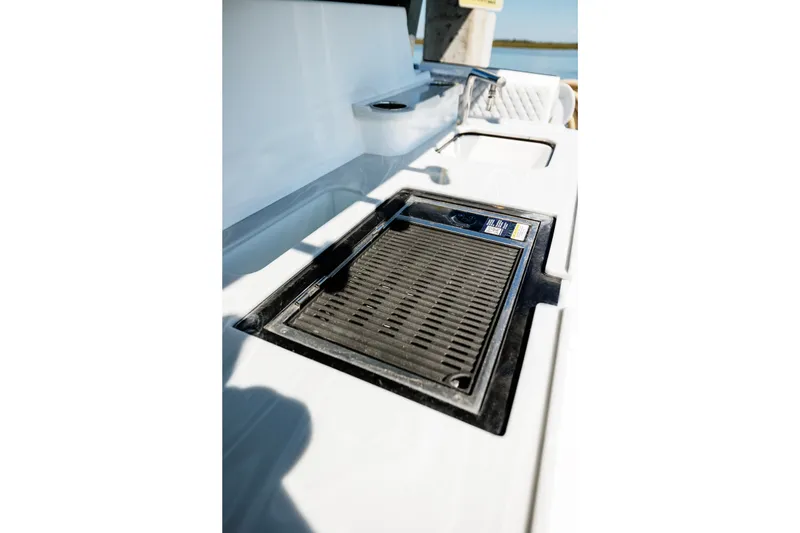 Slide: The Image of Outdoor grill and sink on 2026 HCB 48 Campeón boat deck. - 56