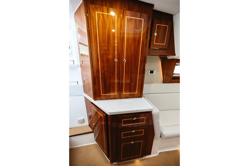 Slide: The Image of Luxurious wooden cabinetry inside 2026 HCB 48 Campeón boat interior. - 24