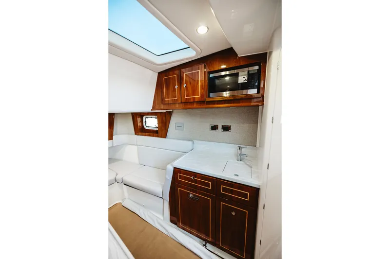Slide: The Image of Luxurious interior of 2026 HCB 48 Campeón yacht with wood cabinetry and modern amenities. - 23