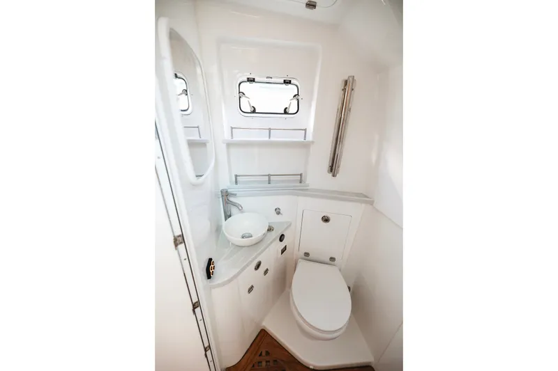 Slide: The Image of Compact bathroom in 2026 HCB 48 Campeón boat, featuring modern fixtures and a sleek design. - 30