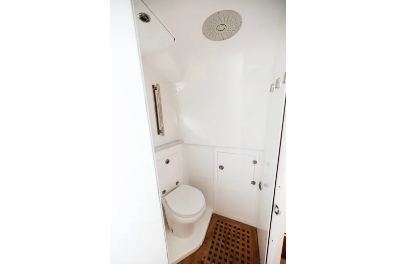Slide: The Image of 2026 HCB 48 Campeón boat bathroom with modern fixtures and wooden flooring. - 29
