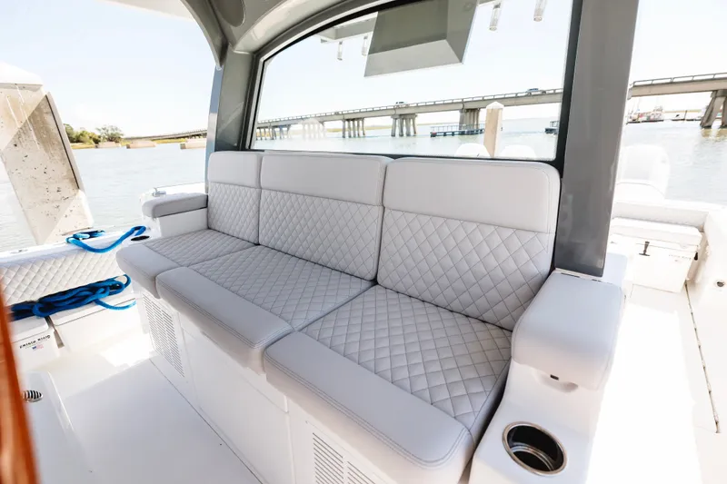 Slide: The Image of Luxurious seating on 2026 HCB 48 Campeón boat with waterfront view. - 19
