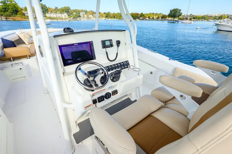 Slide: The Image of Helm of 2015 Southport 33 FE boat with modern controls and comfortable seating. - 2