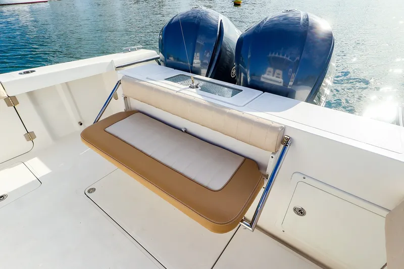 Slide: The Image of 2015 Southport 33 FE boat with dual engines and foldable seating. - 23