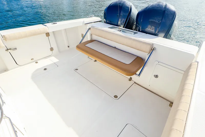 Slide: The Image of 2015 Southport 33 FE boat deck with foldable seat and twin engines. - 24