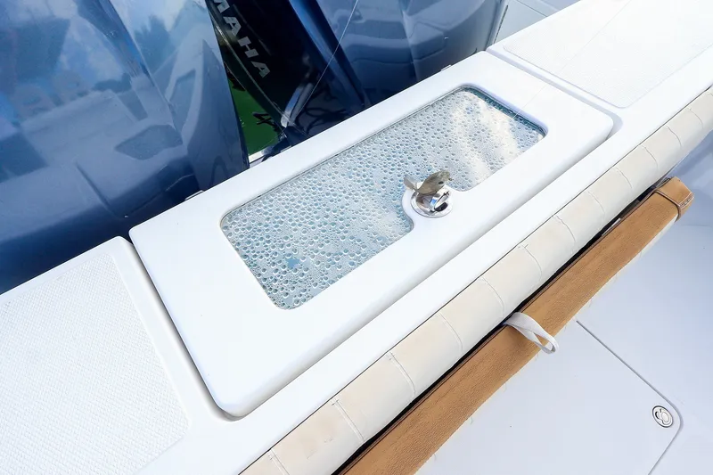 Slide: The Image of Livewell on 2015 Southport 33 FE boat with Yamaha engines in background. - 32
