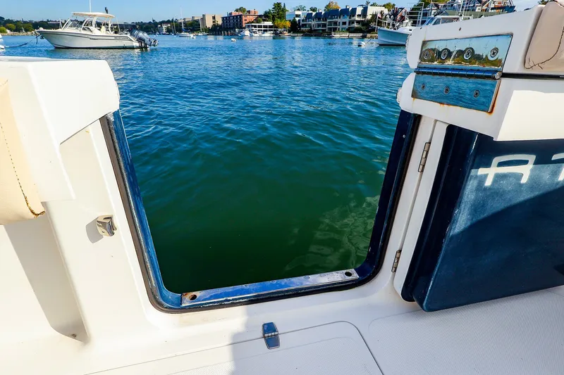 Slide: The Image of View from a 2015 Southport 33 FE boat, overlooking a serene marina. - 26
