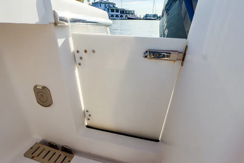 Slide: The Image of 2015 Southport 33 FE boat interior with open hatch and water view. - 36