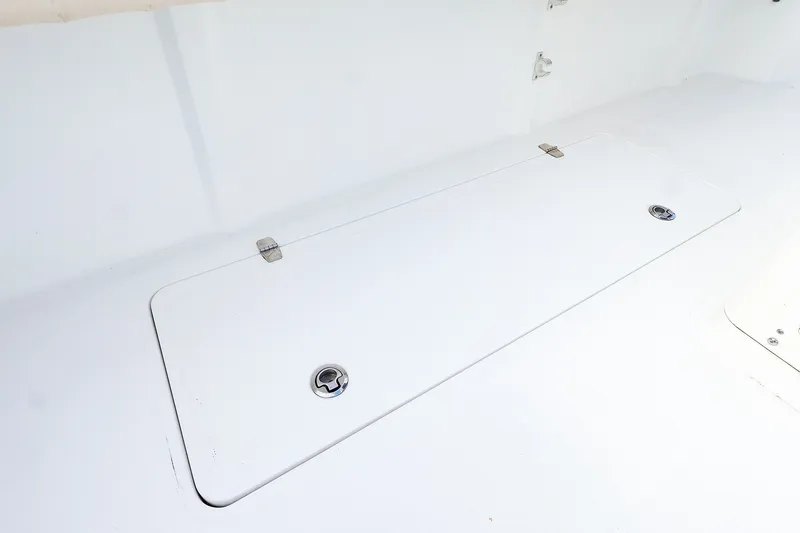 Slide: The Image of 2015 Southport 33 FE boat deck with storage compartment and latch. - 30