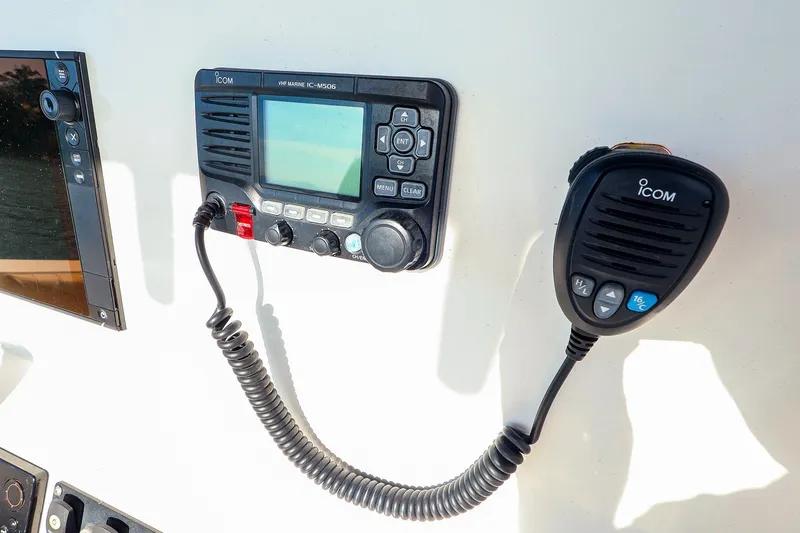 Slide: The Image of ICOM VHF marine radio on 2015 Southport 33 FE boat dashboard. - 9