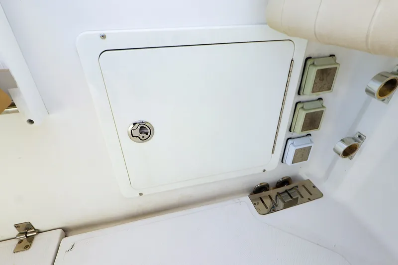 Slide: The Image of Access panel and controls on 2015 Southport 33 FE boat interior. - 34
